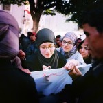 Tunisia, Tunis
A young woman writes on a poster at a demonstration. All those taking part were invited to write what they thought about freedom on it.