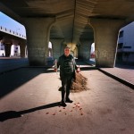 Tunisia, Tunis
A man stands for a portrait holding a bottle of wine and roses on Valentines Day.