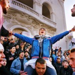 Tunisia, Tunis
Young men sing Koran verses after a demonstration in front of the National Theatre.