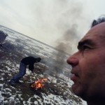 Romania, Bucharest. Joan and Florin burn electric cables for later sell the copper.