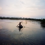 Romania, Bucharest. Florin returns from fishing.