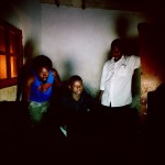 Angola, Luanda. Kuduru/(Kuduro) DJ NEL IT (centre) with friends working late in his self-made recording studio in Sambizanga musseque (slum).